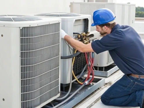 Technician fixing a central air conditioner to determine how much the repair will cost.
